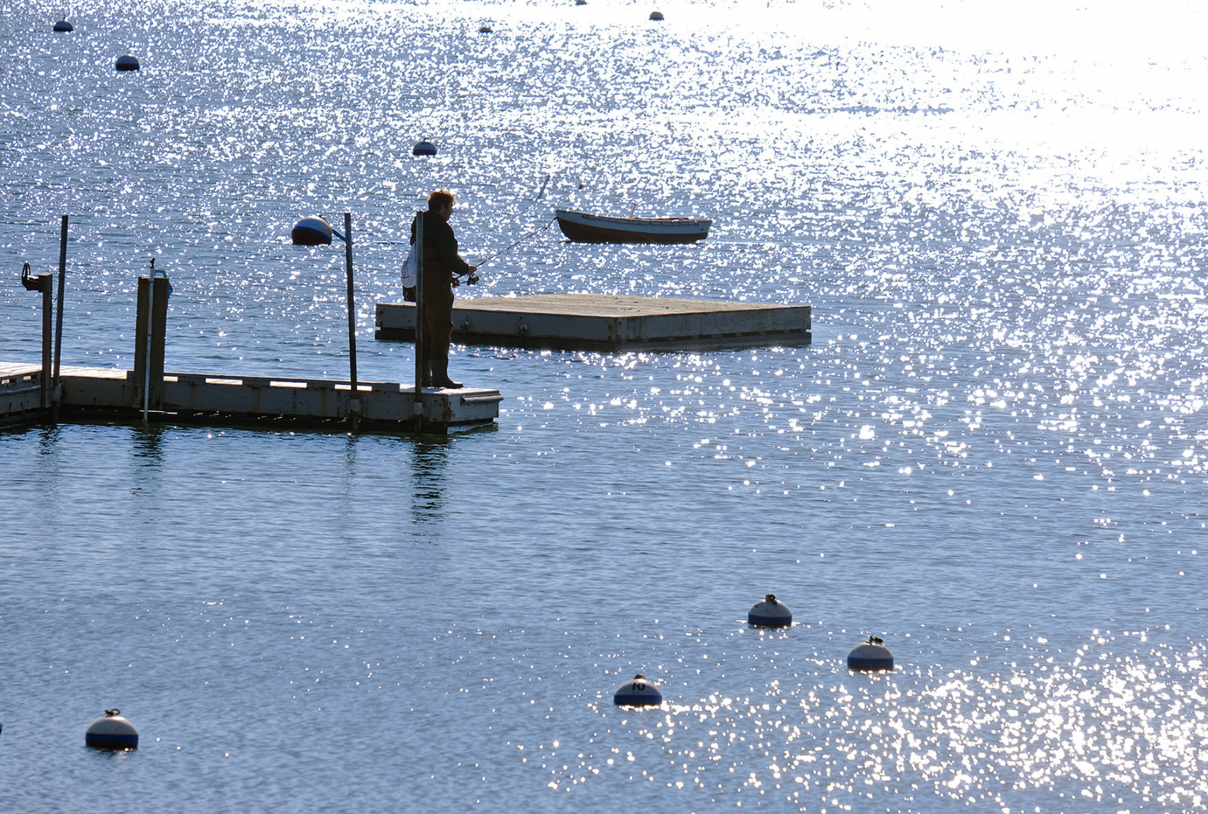 Fisherman On The Dock